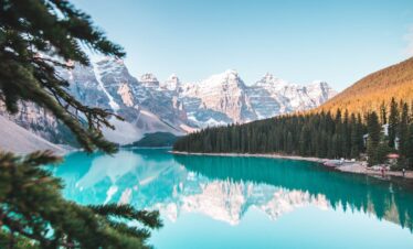 Idyllic view of Moraine Lake reflecting mountains and forests in Banff National Park, Canada.