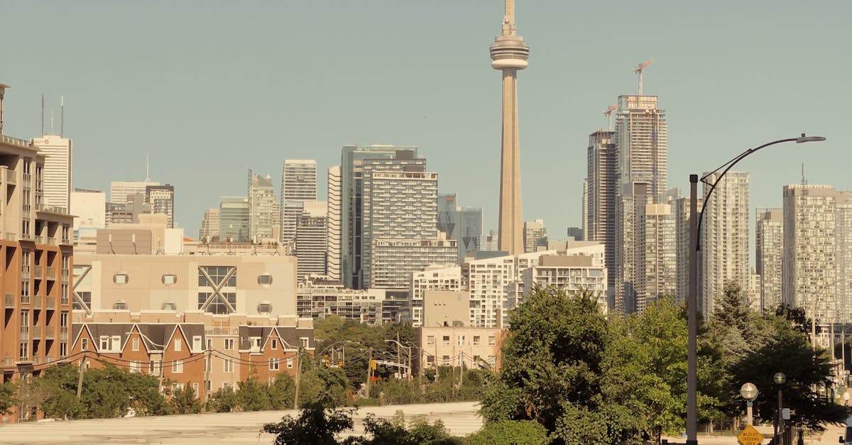 Scenic view of Toronto's skyline including the iconic CN Tower under a clear sky.